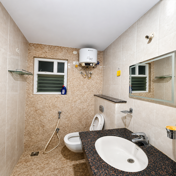 modern bathroom, clean bathroom, hygienic bathroom, well maintained bathroom, premium bathroom, stylish bathroom, tiled bathroom, furnished bathroom, rental property, rental bathroom, comfortable bathroom, spacious bathroom, elegant bathroom, bathroom interior, modern interiors, high quality bathroom, luxury bathroom, functional bathroom, fully equipped bathroom, bathroom with geyser, water heater, western toilet, wash basin, granite countertop, bathroom mirror, glass shelf, chrome fixtures, hot water facility, ventilation, natural light, student accommodation, student friendly accommodation, students, business professionals, working professionals, office goers, corporate stay, co living, shared accommodation, executive stay, budget friendly living, affordable accommodation, clean and tidy bathroom, daily convenience, urban living, modern rental home, comfortable living space, ideal for students, ideal for professionals, home away from home.